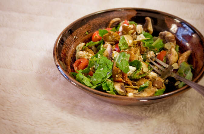 Anton's Warm Chicken Salad, being heartily enjoyed
